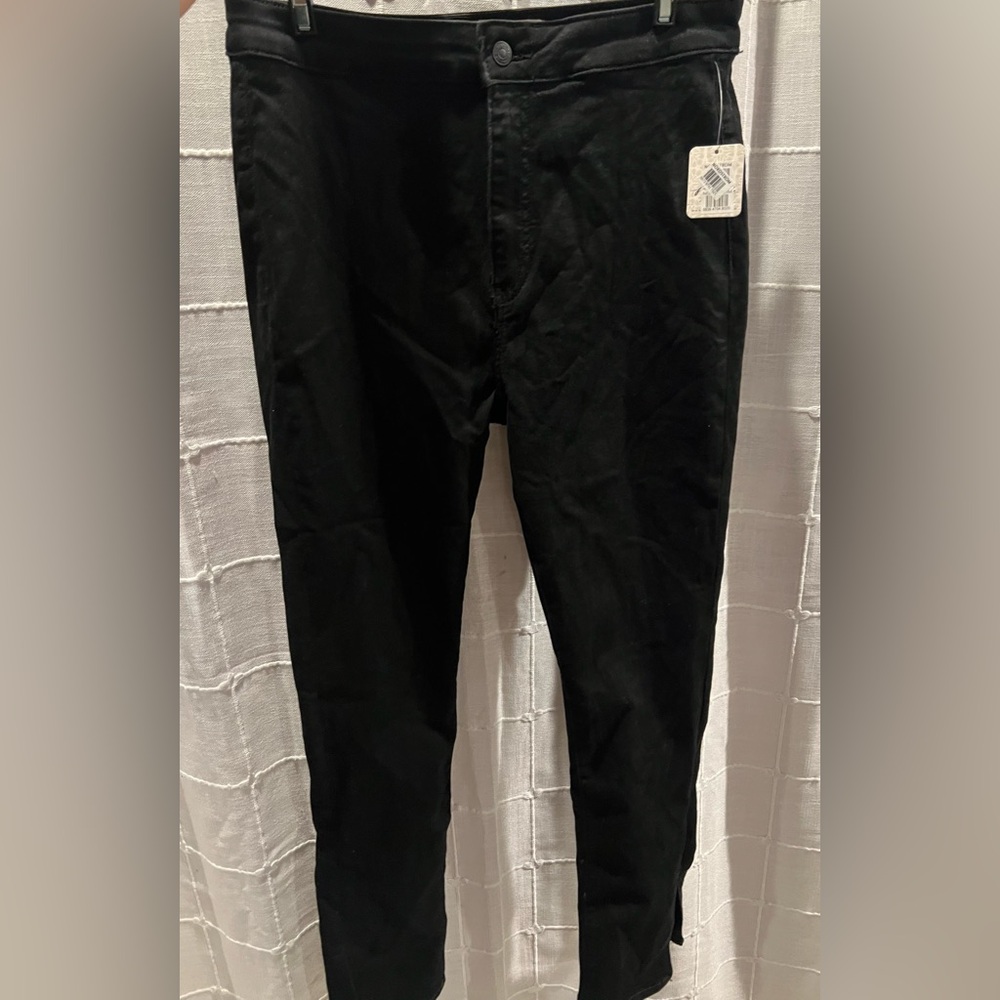 Free People Black Stretch Denim Skinny Jeans with side slit.